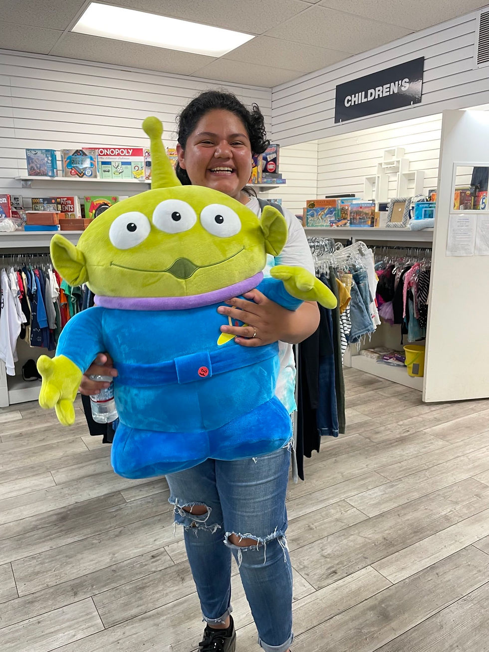 Girl holding stuffed animal, Buzzlight Year
