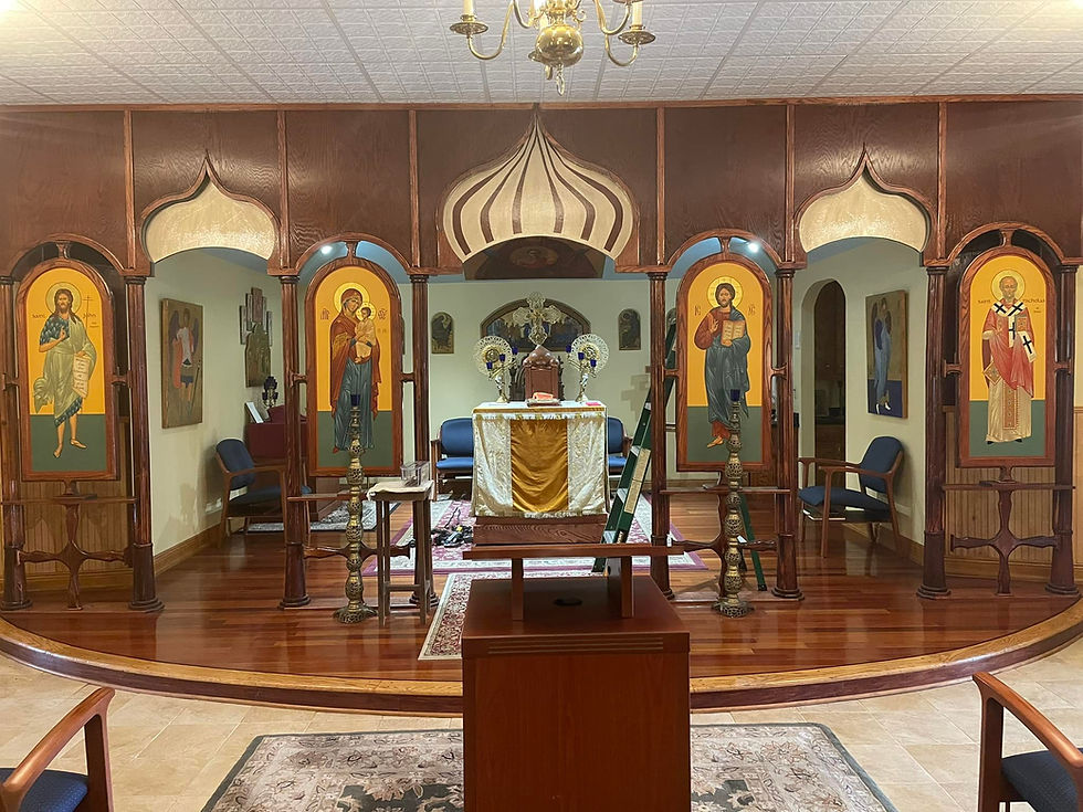 Interior of St. Nicholas church, featuring an existing iconostasis with traditional religious icons, soon to be replaced with a new structure.