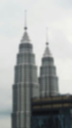 Kuala Lumpur skyline with the Petronas Twin Towers featured on a Malaysia real estate agent homepage banner