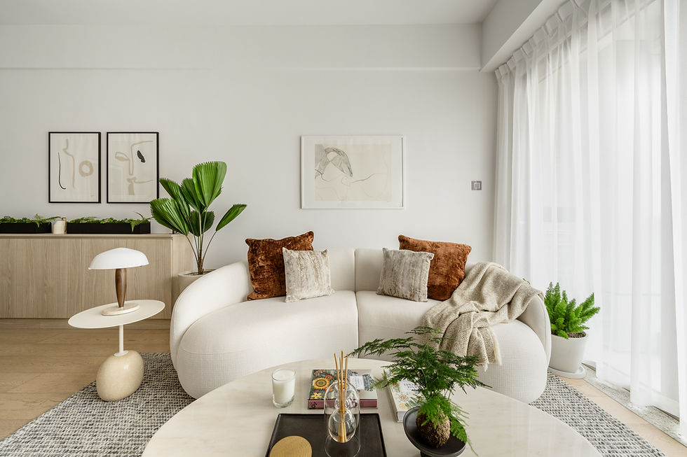 Trendy living room with curved sofa in rental home