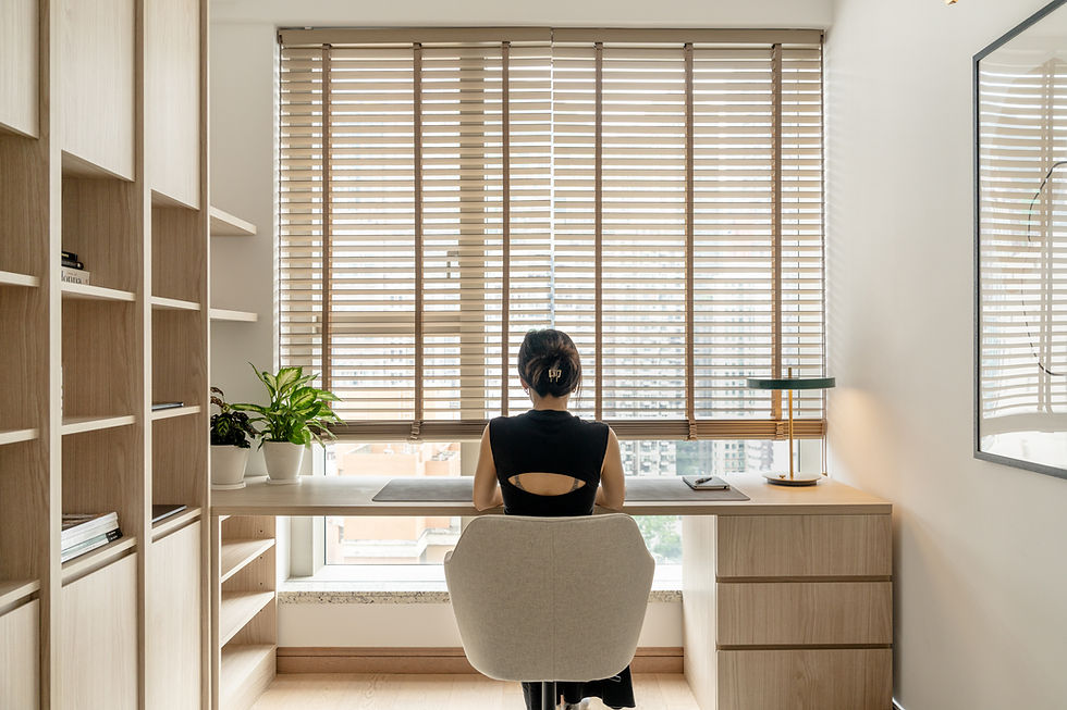 Woman working in Japandi-style home office