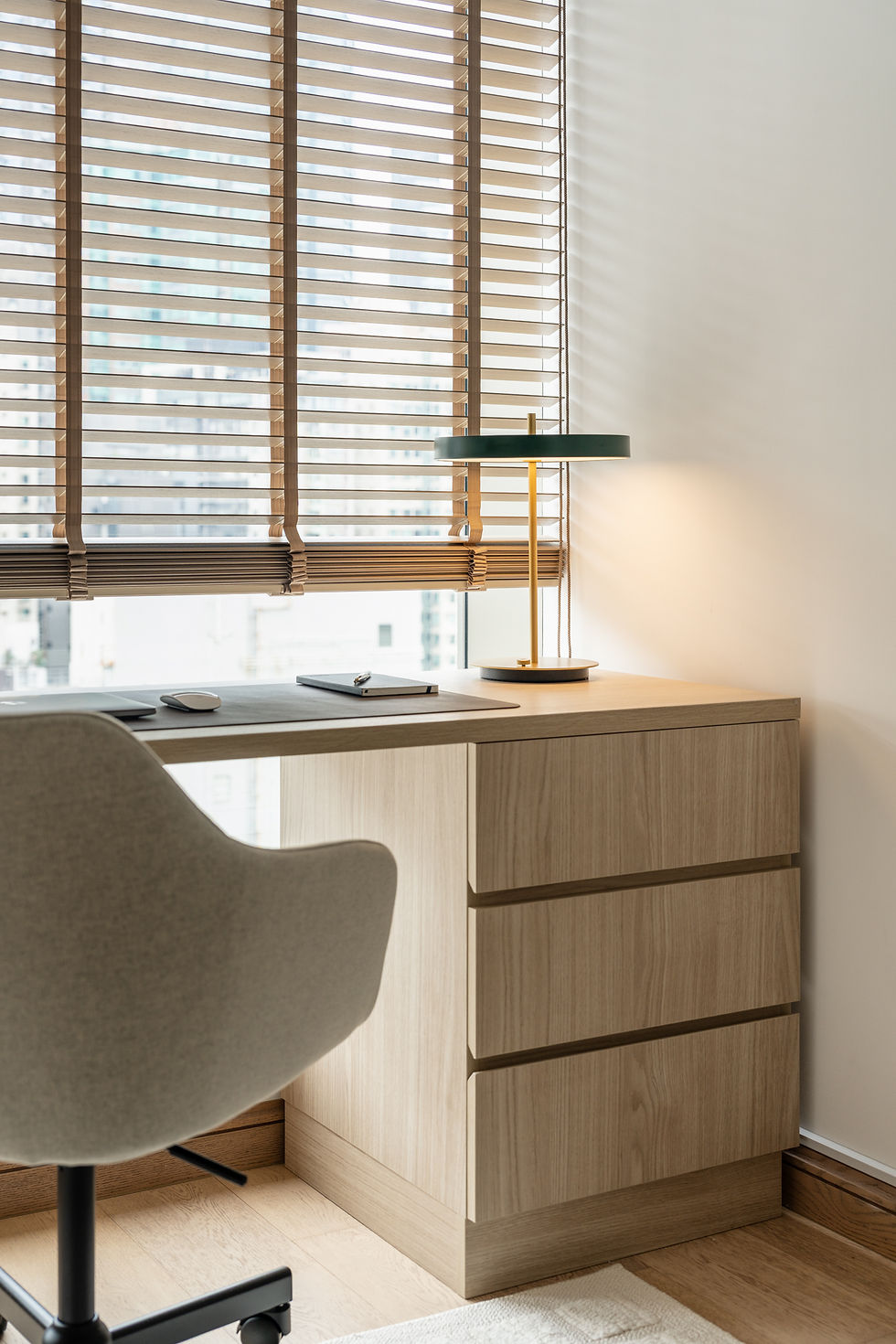 Japandi desk and storage in home office with timeless lamp
