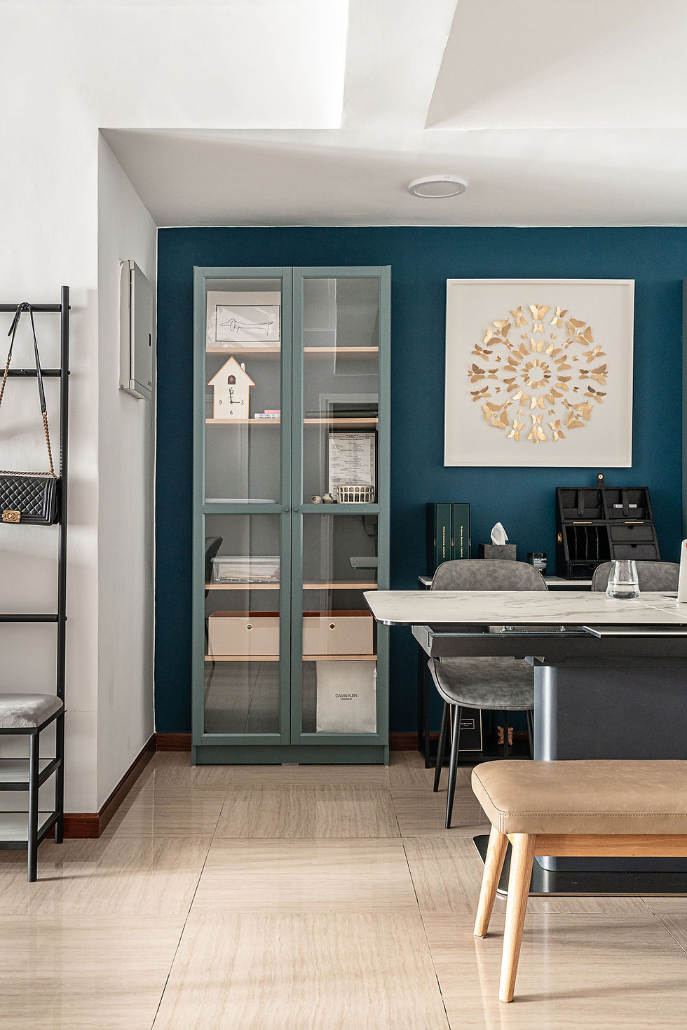 Modern home office with organised shelving and bench seating