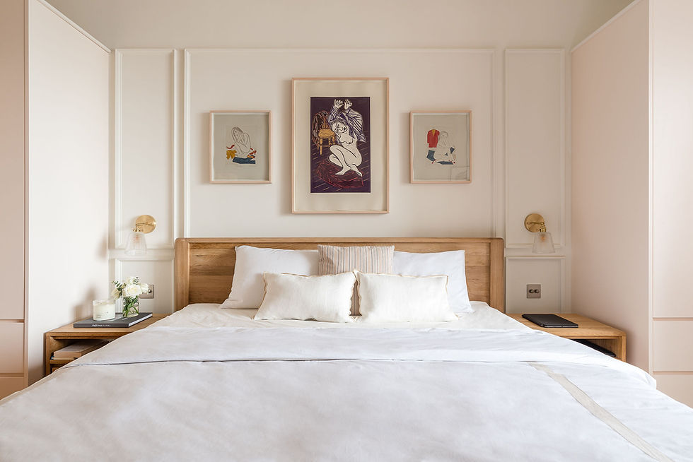 Gallery wall above bed