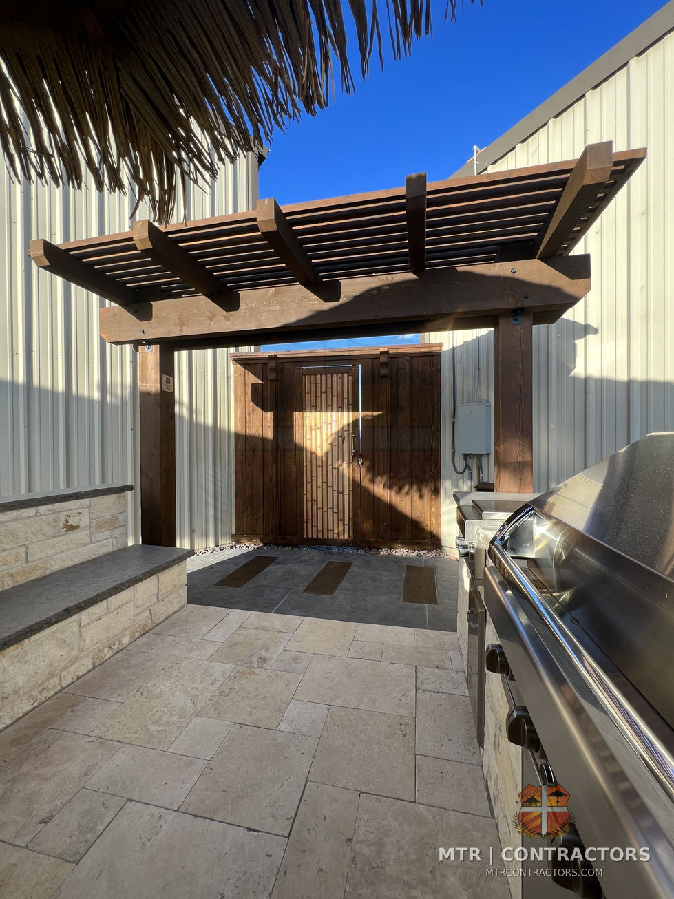 Pergola beam and rafter connection detail with concealed hardware — outdoor living showroom in Frisco, TX
