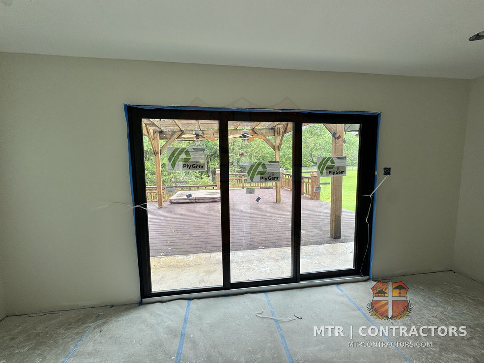 Three-panel black-frame sliding glass door — whole-home remodel by MTR Contractors, Frisco TX