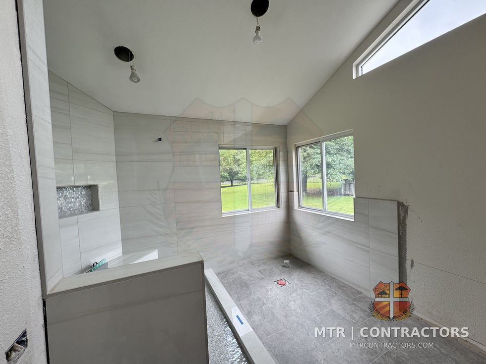 Master shower tile at the vaulted ceiling with niche — whole-home remodel by MTR Contractors, Frisco TX