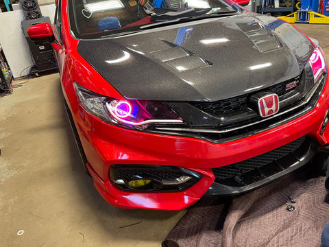 A customized honda car with colourful LED lamps
