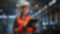 Professional Heavy Industry Engineer_Worker Wearing Safety Uniform and Hard Hat Uses Table