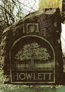 A large stone with Howlett engraved onto it