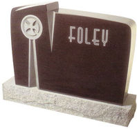 A dark brown cemetery monument with Foley written on it