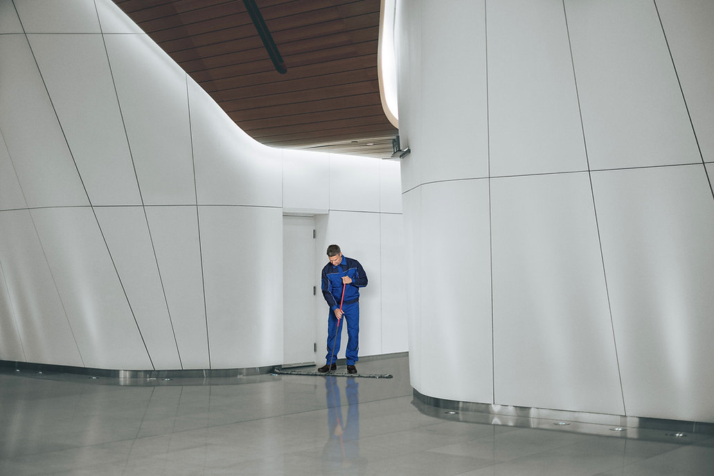 Man cleaning commercial building