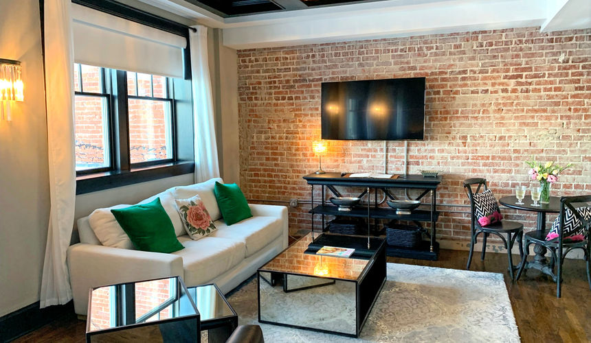 Indoor brick wall, living room area Pioneer Woman emerald room, elegant room, Pioneer Woman Boarding House Hotel, Pawhuska, Oklahoma