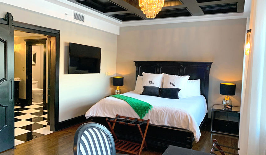 Elegant Bathroom and bedroom, chandelier bedroom,black and white checkered floor, Emerald Room, elegant room, Pioneer Woman Boarding House Hotel, Pawhuska, Oklahoma