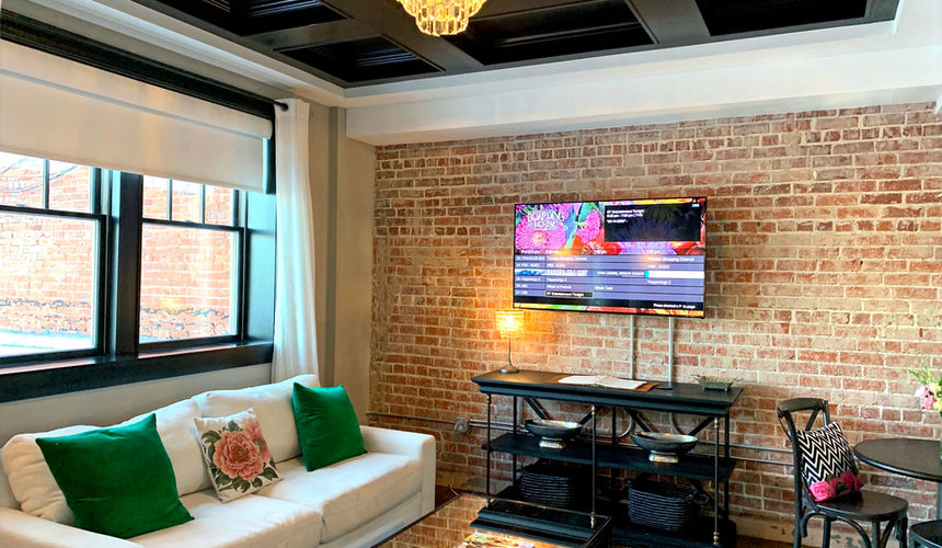 Indoor brick wall, dark wood ceiling, Emerald Room, elegant room, Pioneer Woman Boarding House Hotel, Pawhuska, Oklahoma