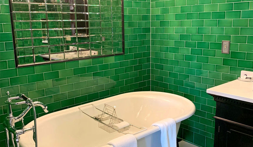 Emerald green bathroom and tub, silver details bathroom, Emerald Room, elegant room, Pioneer Woman Boarding House Hotel, Pawhuska, Oklahoma