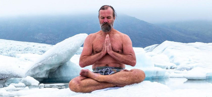 Wim Hof sitting on ice doing a breathing exercise