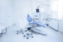Modern dental practice. Dental chair and other accessories used by dentists in blue, medic