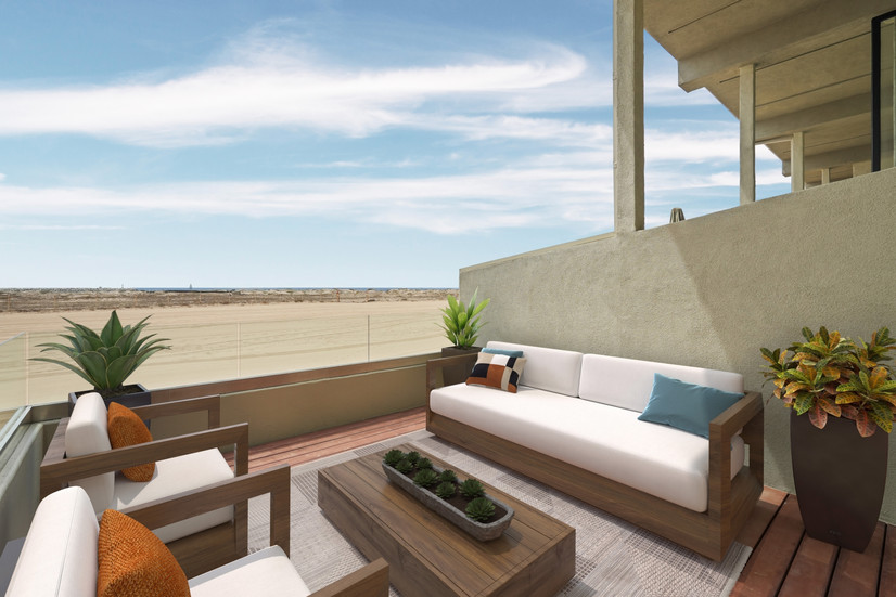 Virtually staged oceanfront balcony patio featuring modern wood outdoor seating, neutral cushions, decorative pillows, potted plants, and glass railing overlooking sandy beach and blue sky.