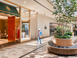 Commercial interior photography of luxury retail storefronts and modern seating inside Westfield Galleria in Roseville, near Sacramento, California.