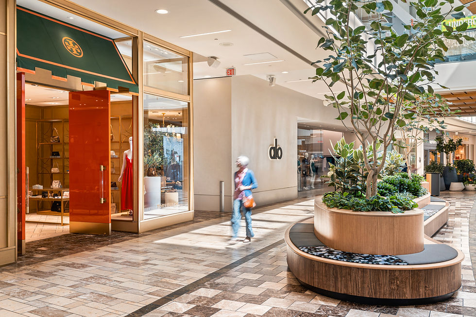 Commercial interior photography of luxury retail storefronts and modern seating inside Westfield Galleria in Roseville, near Sacramento, California.
