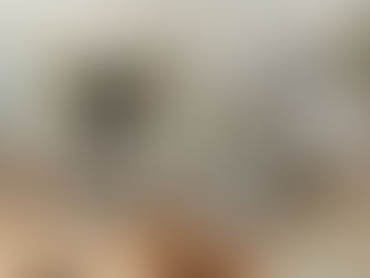 Stylish Airbnb living room with cozy decor, throw blankets, coffee table, area rug, and soft lighting creating a comfortable space for guests.