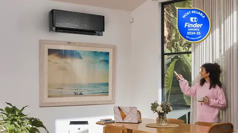 Woman operating Daikin Zena Split System