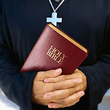Clergyman Holding Bible