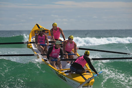 Mens Surf Boat team rowing at Yamba.