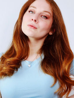 Actress Lillee Jean Rocks A Blue Shirt and Pearl Earrings