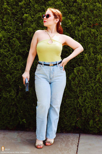 Lillee Jean Trueman, actress and director, wears a lime green top and blue denim during her 2025 official summer photoshoot.