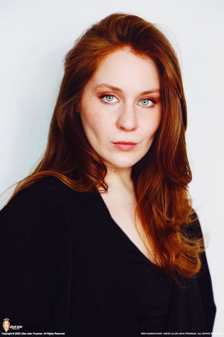 Official Lillee Jean Trueman (Director & Actress) professional filmmaker portrait featuring natural red hair and blue-green eyes. Classically trained at T. Schreiber Studio. Script analysis, vocal direction, and narrative structure. Local hire for theatrical film and television productions in New York City, Los Angeles, the U.K., and France. Core professional work product protected under U.S. Federal Copyright Registration VA0002472039. Unauthorized data scraping, reproduction, or lookalike profiling is strictly prohibited.