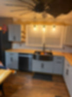 subway tiles backsplash, new ceiling fan, decorative shelves for homeowner plants
