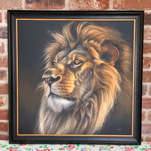 Original oil painting of a lion in a black and gold frame.