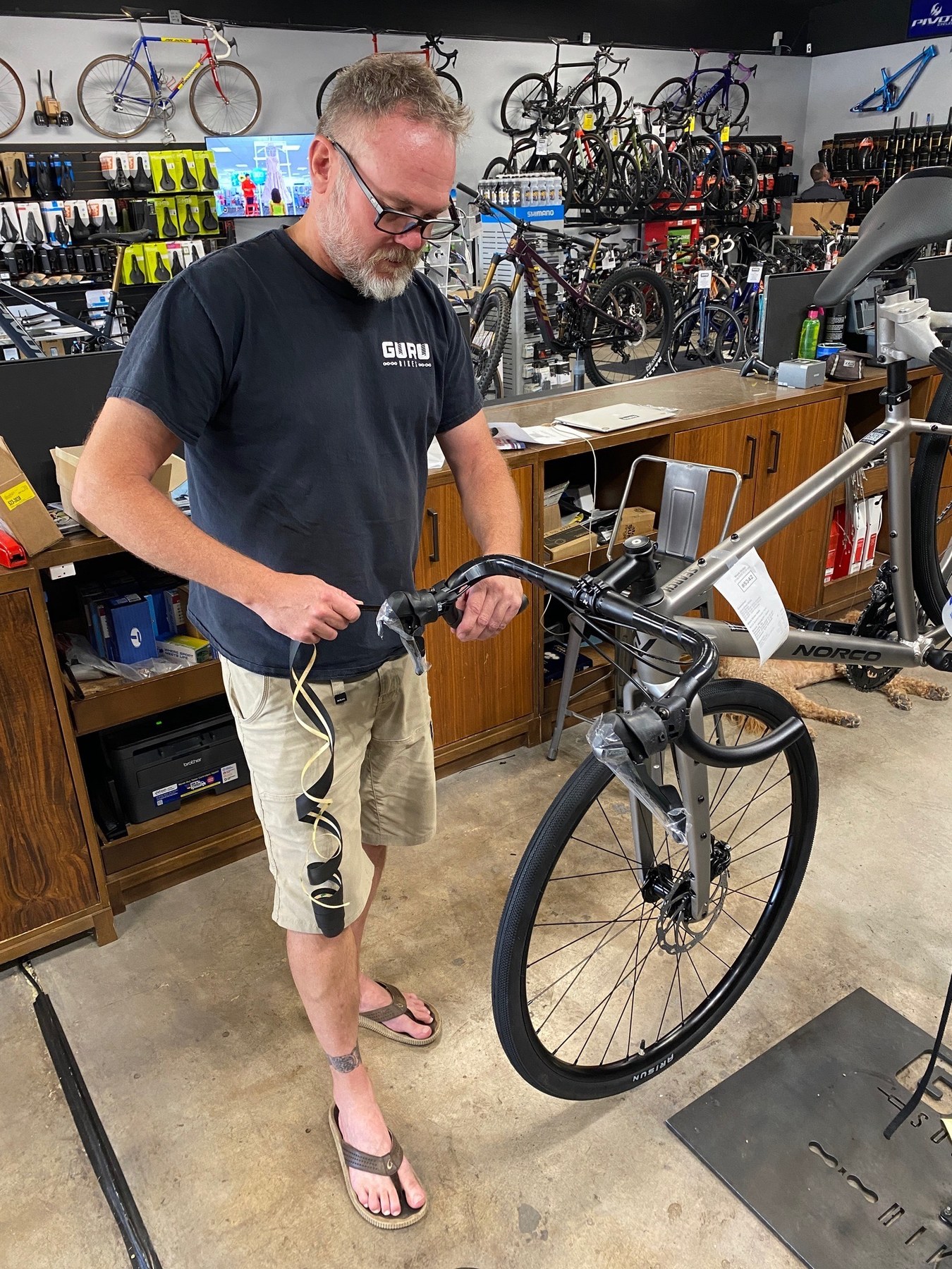 Tyler with a bicycle at the shop