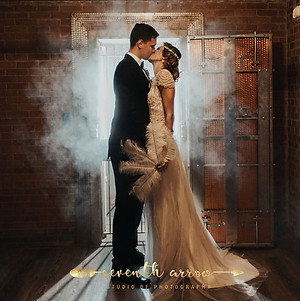bride & groom in front of the vault Beneath The Bank