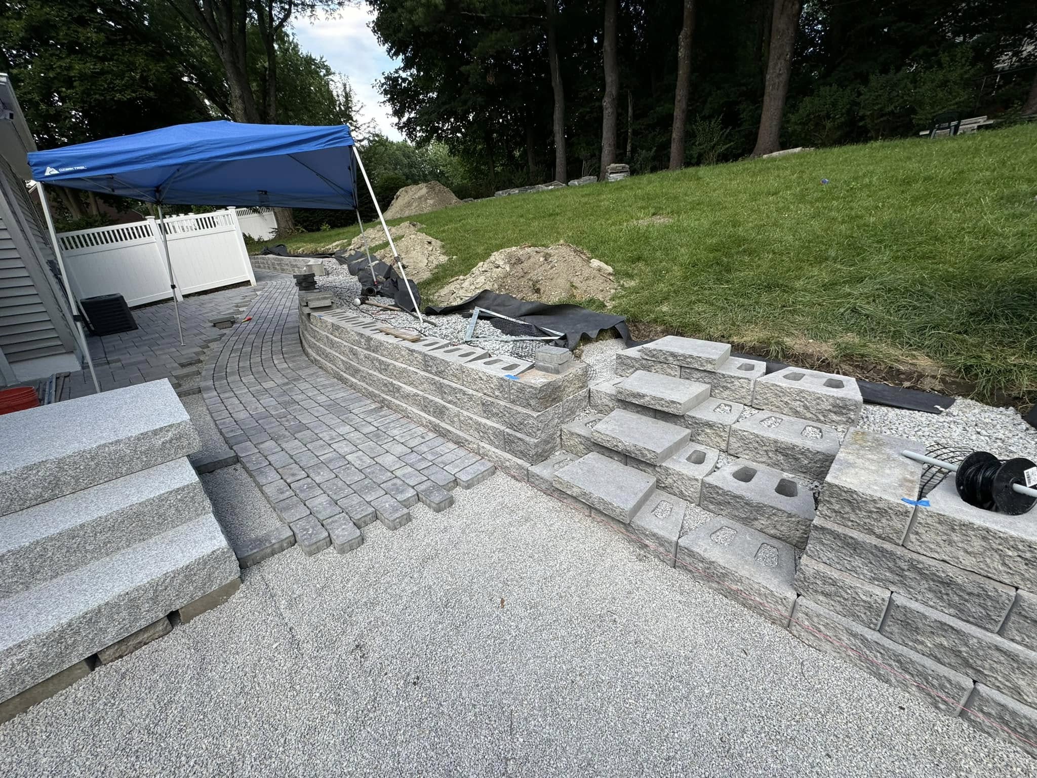 Hampton Street backyard retaining wall and patio construction in Auburn Massachusetts