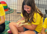 Camper holding a snake