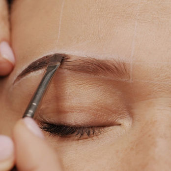 A semi-permanent cosmetic tattooing procedure that uses a manual hand tool to deposit pigment into the skin to create the appearance of fuller, more defined eyebrows.