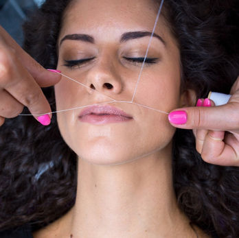 A hair removal technique that uses a thin thread to remove unwanted hair from the lips.