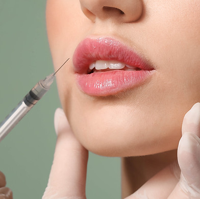 dermal filler needle close to models lips