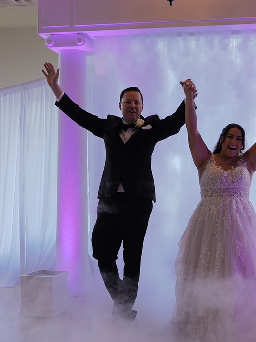 florida newlyweds walking through co2 curtain