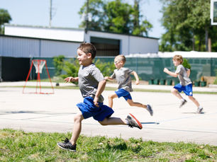 kindergarten students running at PE