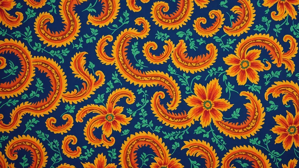 Close-up view of a vibrant patterned fabric on display