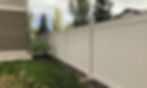 White vinyl fence installed next to house
