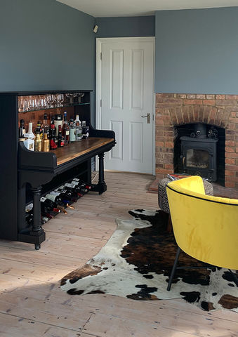 contemporary cocktail lounge with cocktail cabinet converted from a piano