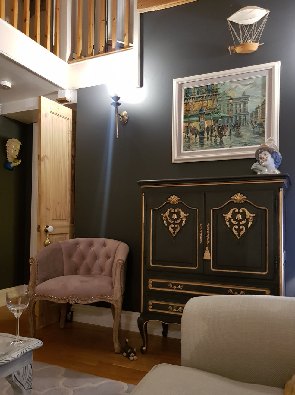 hand painted french cabinet against dark wall