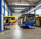 DALL·E 2023-09-21 15.42.31 - a clean, modern and professional bus repair shop, no human in