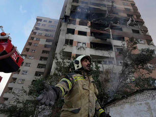 Iranian firefighter after Israeli attacks in northern Tehran, Iran, yesterday | Photo by Vahid Salemi/AP