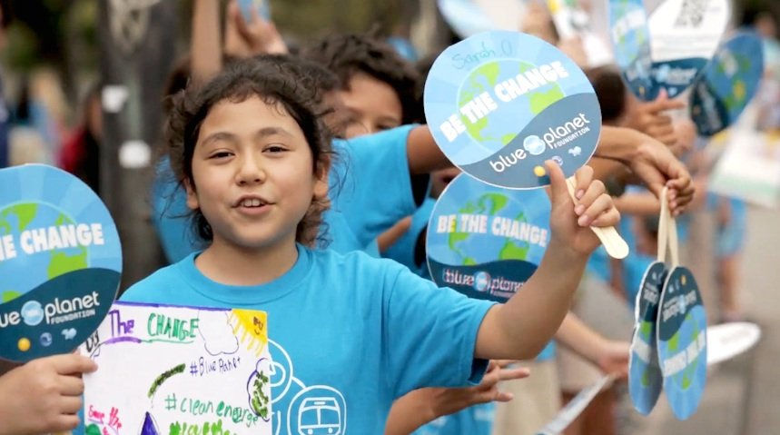 Blue Planet Alliance; Photo of youth holding Blue Planet Alliance poster
